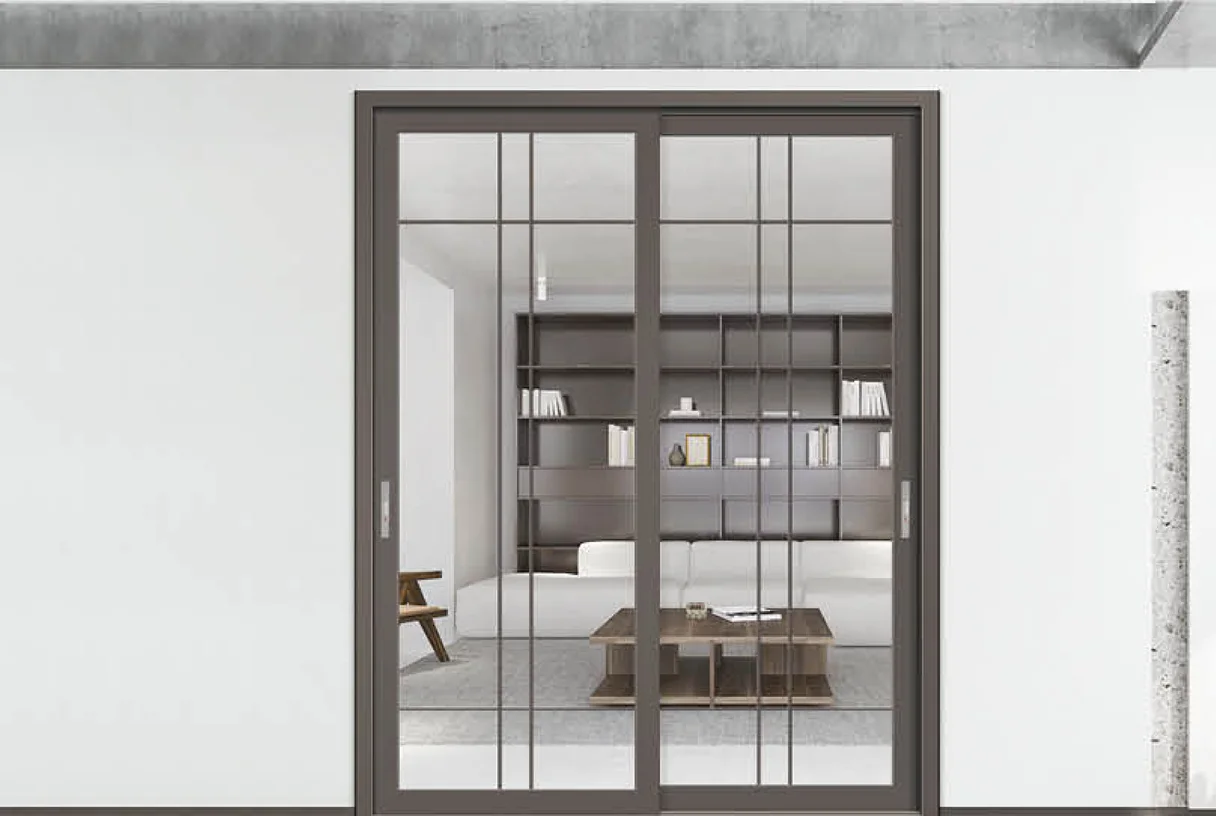 Two-panel grey aluminium sliding door with grille bars in a minimal study, design rendering