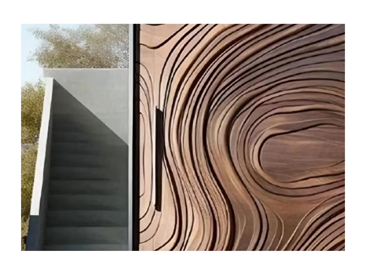 Close view of the carved ripple wood-grain pattern and the edge of the entrance leaf