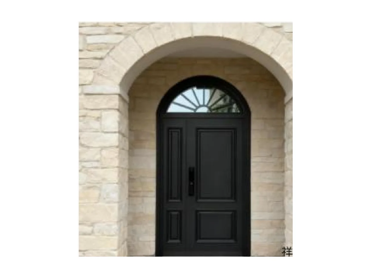 Front view of a black aluminium arc entrance leaf with a half-round glazed window set into a stone arch