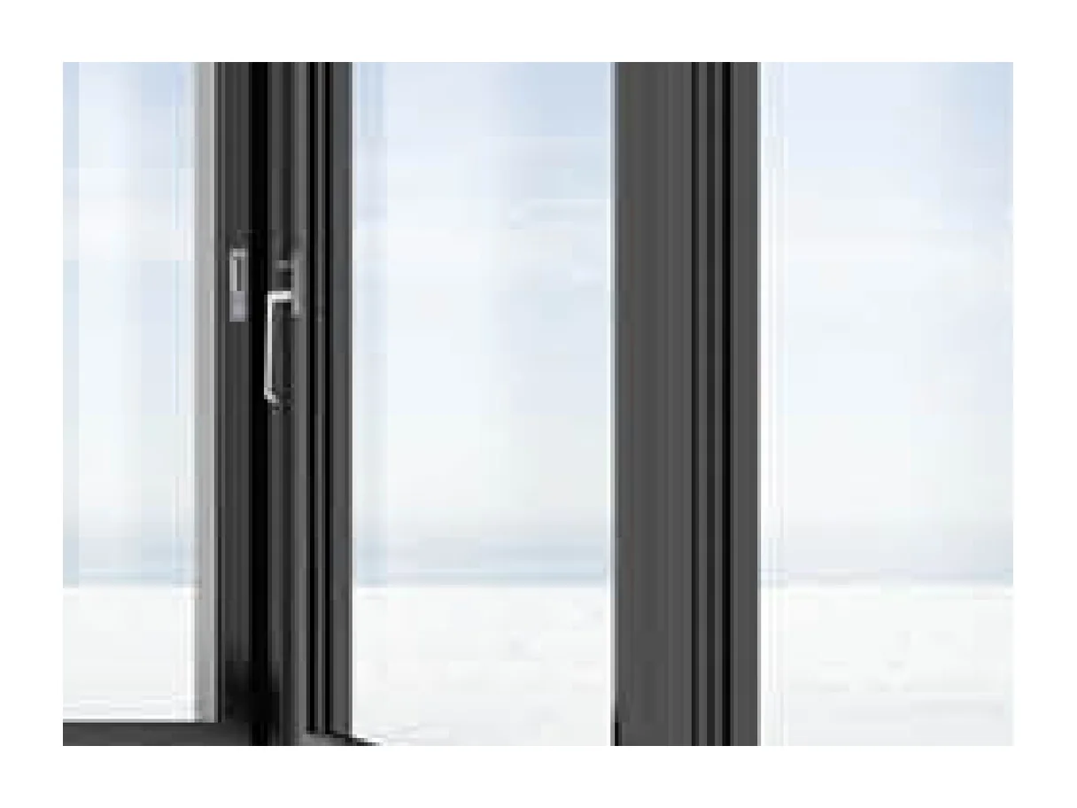 Close view of the aluminium leaf stile and lever handle on the lift and slide door, with glass beyond