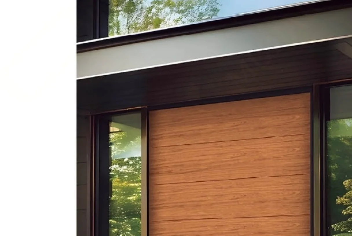 Off-axis pivot entrance door in imitation wood grain under a canopy beside a full-height glass wall, design rendering