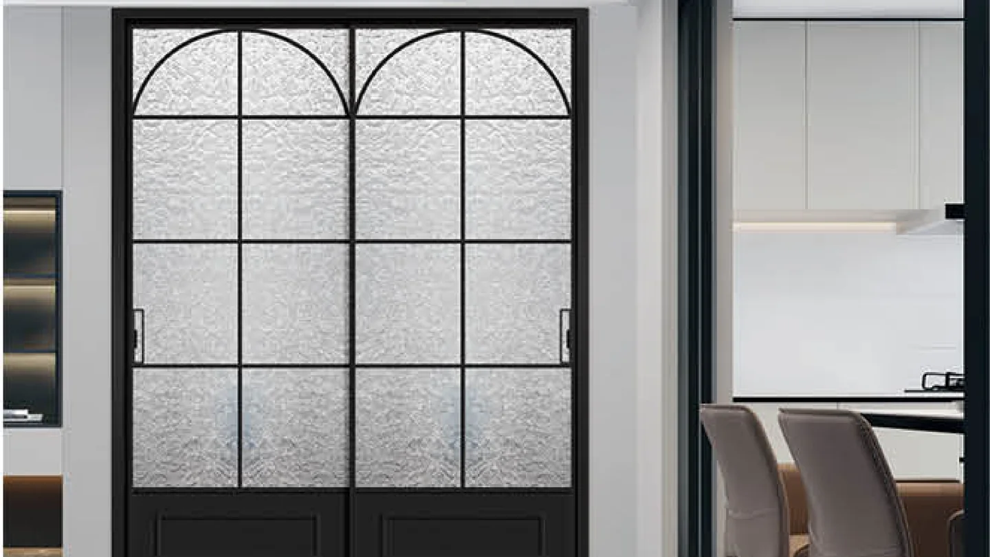 Black double-leaf vintage door with arched heads and textured craft glass, kitchen and dining room beyond, design rendering