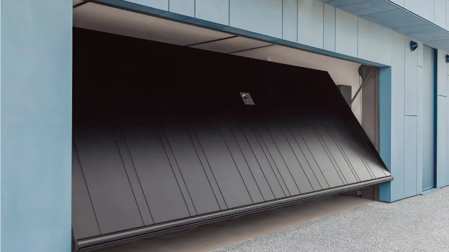 Aluminium up and over garage door with a panelled leaf on a rendered driveway, design rendering