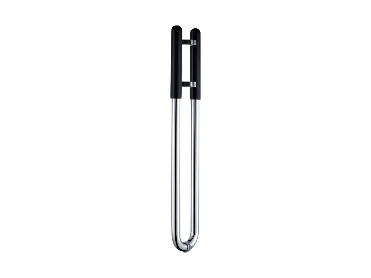 Wood-look aluminium door handle with its fixings laid beside it, catalogue studio shot