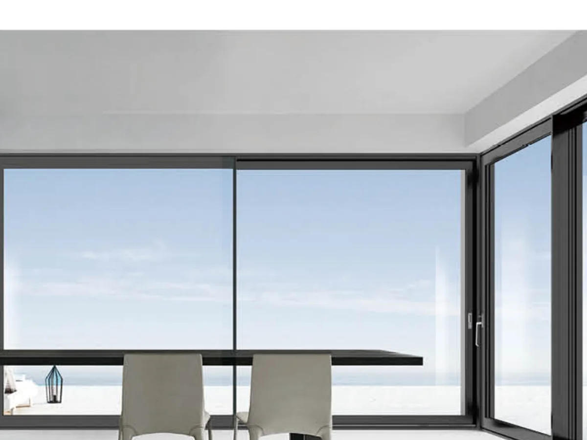Close view of the slim aluminium frame and glazed panel of a sliding interior leaf, design rendering