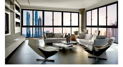 High-rise living room with 95 series sliding window onto a city skyline