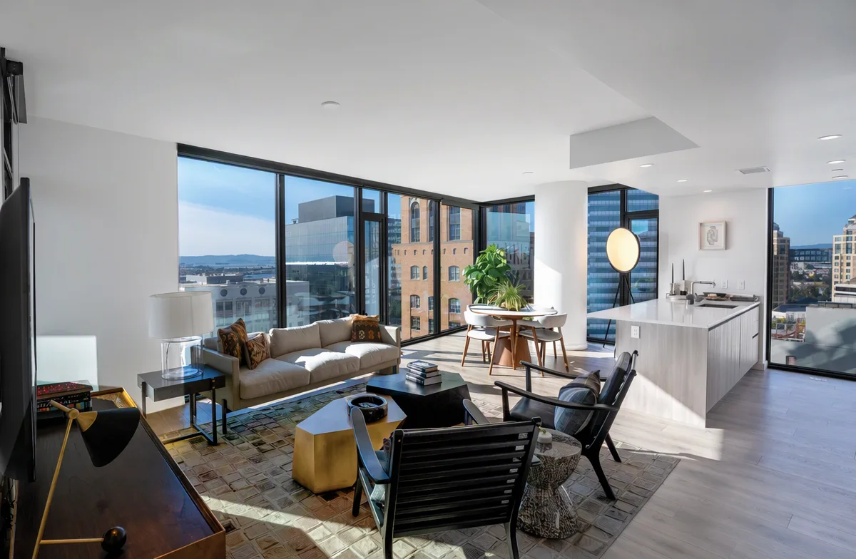 High-rise apartment living room with full-width black aluminium sliding windows
